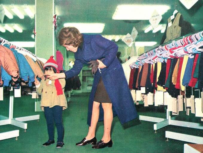 Modern Mother in mall and his kid 1970s